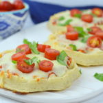 Waffle Pizzas are a family favorite all you need is your favorite pizza sauce, Eggo Thick & Fluffy waffles, mozzarella, cherry tomatoes, & basil - quick, easy, & yummy!