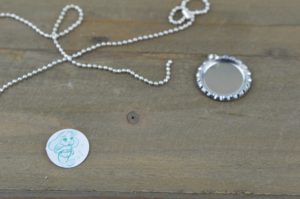 These fun and easy bottle cap necklaces are a great DIY craft for fish extender or pixie dust gifts for your next Disney Cruise.