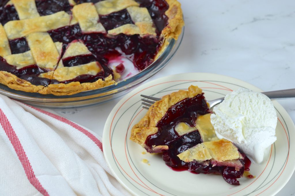 This easy and delicious cherry pie has a flaky crust that is filled with homemade cherry pie filling.  It is bursting with cherry flavor that's both sweet and tart. 