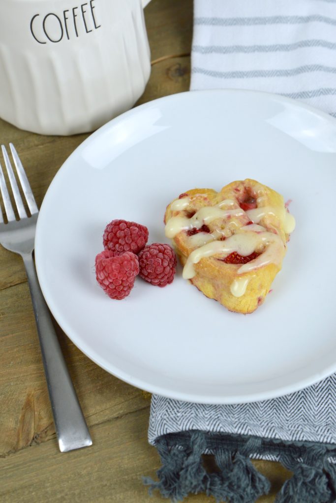 There is nothing like warm, ooey-gooey homemade heart-shaped berry sweet rolls for breakfast on Valentine's Day!