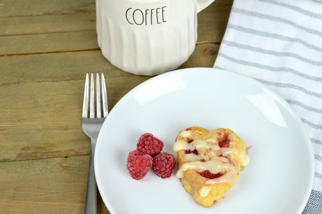 There is nothing like warm, ooey-gooey homemade heart-shaped berry sweet rolls for breakfast on Valentine's Day!