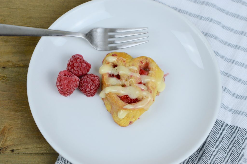 There is nothing like warm, ooey-gooey homemade heart-shaped berry sweet rolls for breakfast on Valentine's Day!