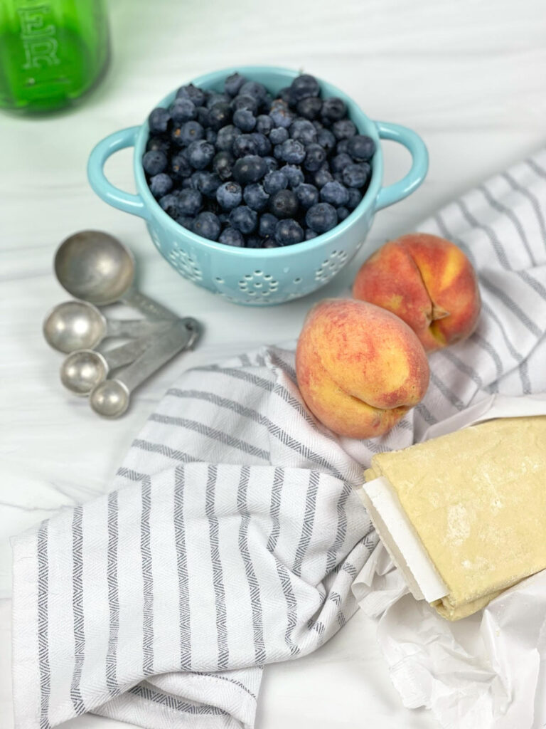 Gorgeous mini peach blueberry galettes are the perfect, fun, and simple dessert with seasonal fruit.