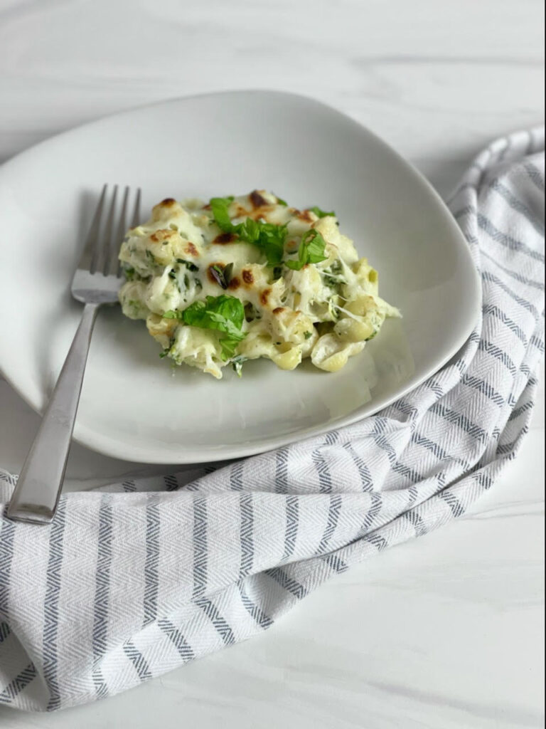 This cheesy, vegetable-filled Spinach Artichoke Pasta Bake will become a family favorite and it is easy enough to make for a weeknight meal.