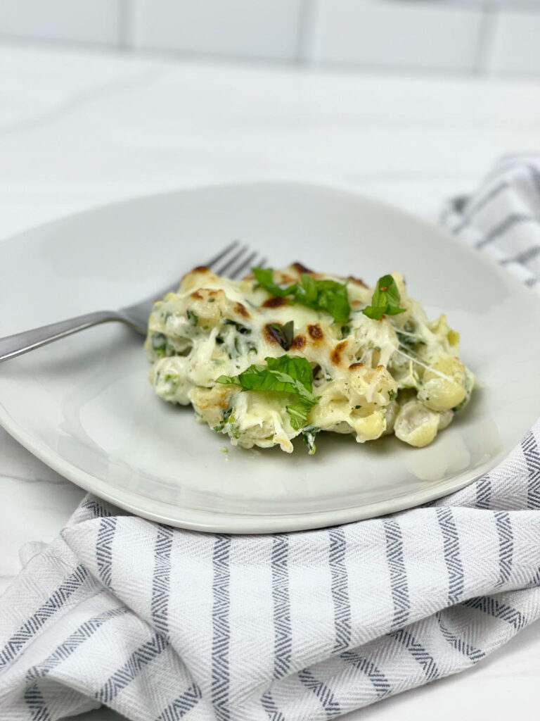 This cheesy, vegetable-filled Spinach Artichoke Pasta Bake will become a family favorite and it is easy enough to make for a weeknight meal.