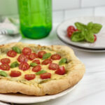 Are you always looking for quick dinner ideas that the whole family will enjoy? This flavorful and savory Three Cheese Pesto Pizza is a family favorite.