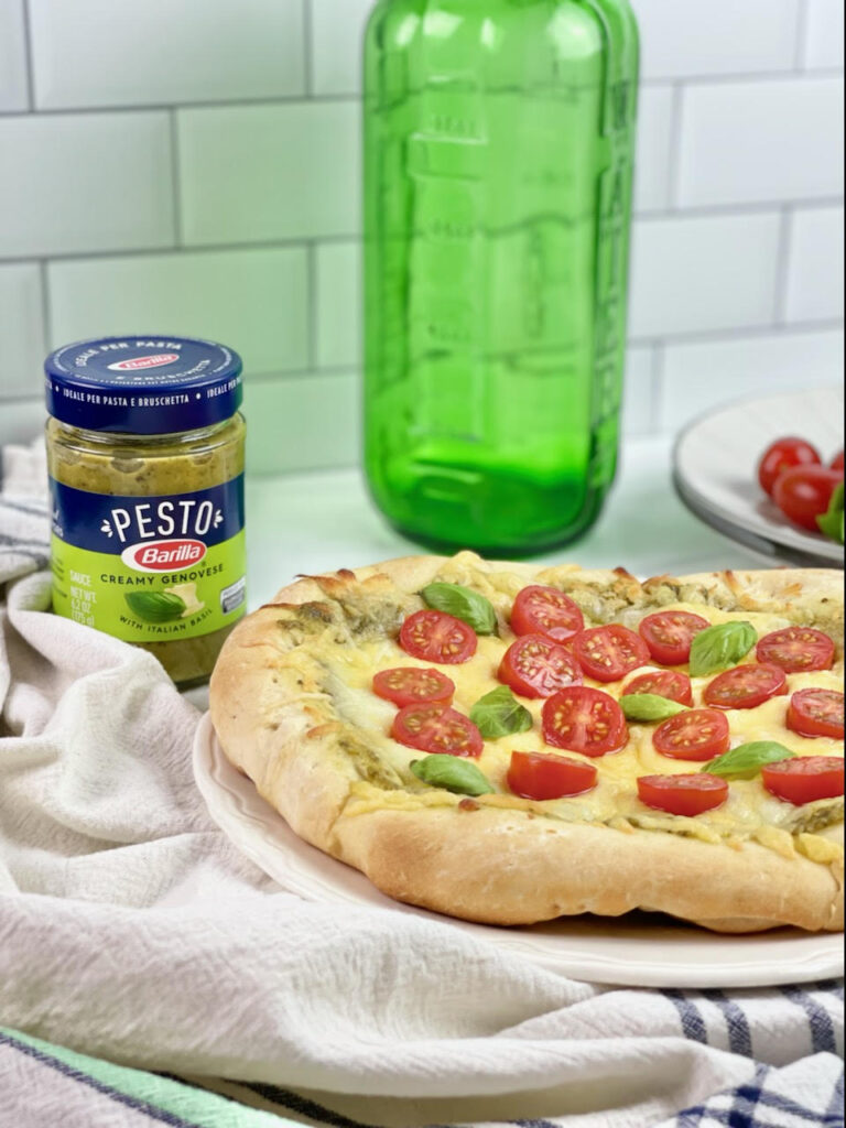 Are you always looking for quick dinner ideas that the whole family will enjoy? This flavorful and savory Three Cheese Pesto Pizza is a family favorite.