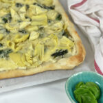 This cheesy, vegetable-filled Spinach Artichoke Pizza is an easy weeknight meal that the whole family will love.