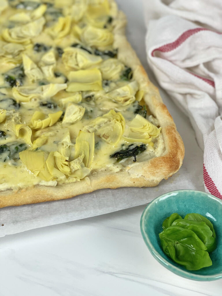 This cheesy, vegetable-filled Spinach Artichoke Pizza is an easy weeknight meal that the whole family will love.