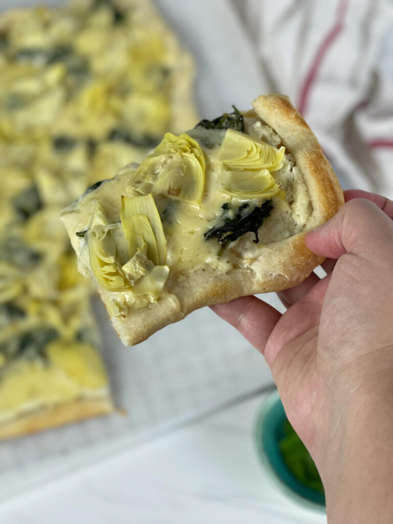 This cheesy, vegetable-filled Spinach Artichoke Pizza is an easy weeknight meal that the whole family will love.