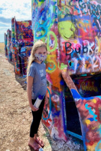 Everything you need to know about visiting Cadillac Ranch. This kitsch roadside attraction located near Amarillo, Texas is an experience you don't want to miss.