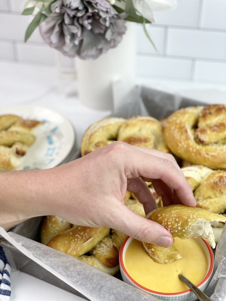 These soft and delicious homemade pretzels with a creamy beer cheese dipping sauce are easy to make and perfect for get-togethers. 