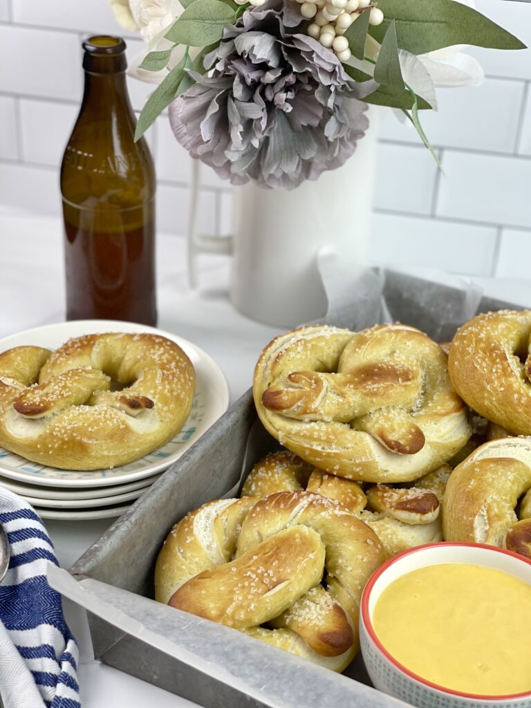 These soft and delicious homemade pretzels with a creamy beer cheese dipping sauce are easy to make and perfect for get-togethers. 