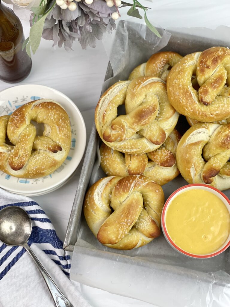 These soft and delicious homemade pretzels with a creamy beer cheese dipping sauce are easy to make and perfect for get-togethers. 