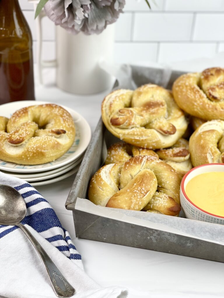 These soft and delicious homemade pretzels with a creamy beer cheese dipping sauce are easy to make and perfect for get-togethers. 