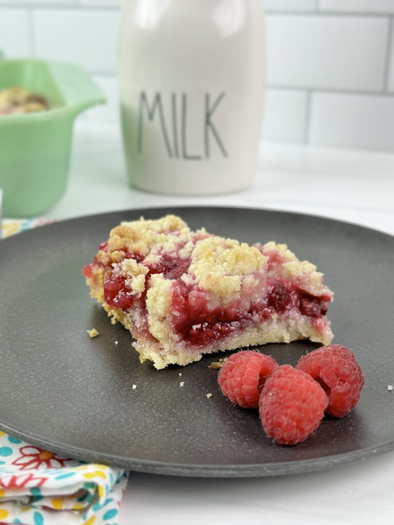 These Raspberry Crumble Bars combine the tart flavors of raspberries with a buttery base and delicious crumble topping. Making these rich buttery raspberry-filled bars takes very little time and only a few ingredients.