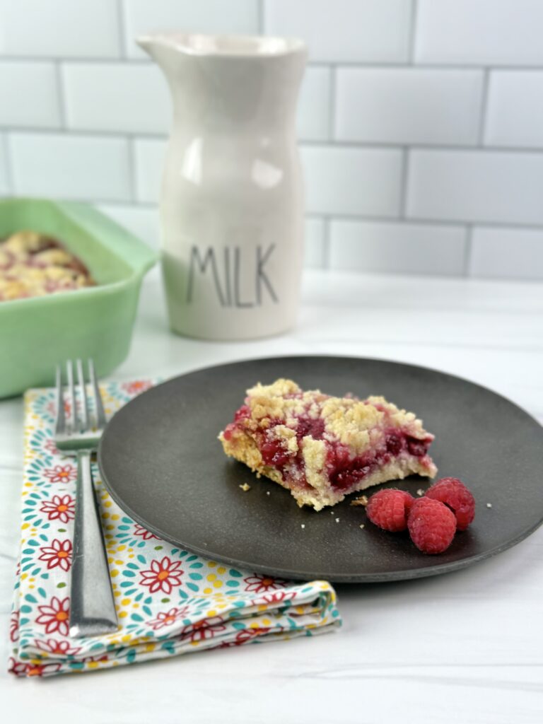 These Raspberry Crumble Bars combine the tart flavors of raspberries with a buttery base and delicious crumble topping. Making these rich buttery raspberry-filled bars takes very little time and only a few ingredients.