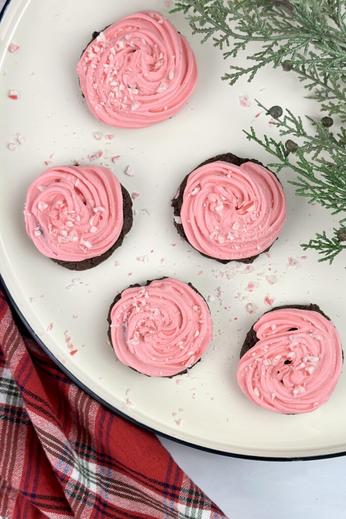 These decadent chocolate cookies and creamy peppermint frosting are the perfect combination of peppermint chocolate cookies perfect for this holiday season.