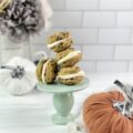 Soft and chewy pumpkin chocolate chip sandwich cookies stuffed with cream cheese frosting are a must-try this fall!